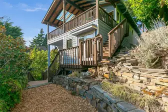 Main deck has stair access to the level yard space; a great spot for a hammock or furry friends to romp.