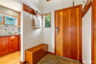 Entry welcomes you to this home with space to kick off shoes and welcome guests.