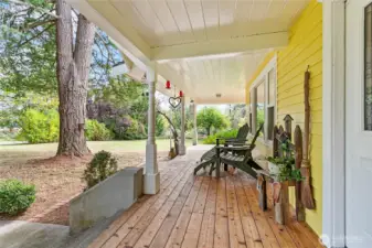 Inviting covered front porch, extends partially around home