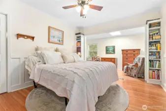 Owner's suite on main floor w/wainscoting, built ins, sitting room (w/even more storage around corner), walk-in closet (to left of bed). So much character!