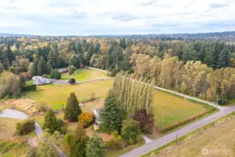 Home is cozily surrounded by mature landscaping providing a nice windbreak