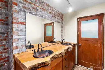 Downstairs Bathroom with custom counter & copper sinks