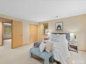 Master bedroom with his and hers closets