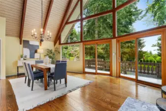 Dining area, rich Hardwoods throughout and floor to ceiling windows to view Mt. Rainier and the grounds beyond