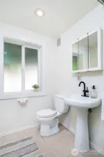 Downstairs 3/4 bath feels clean and spacious.