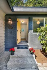 The welcoming front walkway and cheerful entry set the tone—come on in!