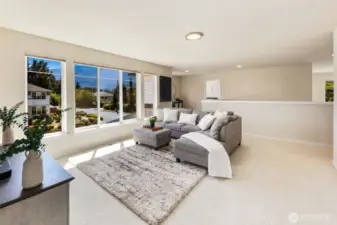 Bonus room with beautiful large windows that bring in natural light and take in the mountain views.