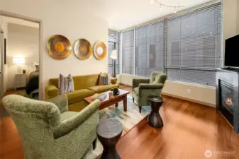 Living room is anchored by a gas burning fireplace.