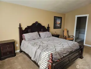 Primary bedroom with vaulted ceilings