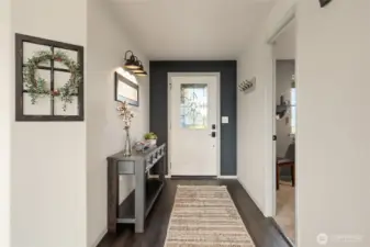 The quality, style, and clean lines in this entry are indicative of what you'll find throughout the home--it's FABULOUS!  First bedroom/office seen on right.