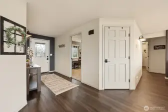 Warm tones in the LVP flooring are just the beginning of their appeal--this home has radiant heat so your floors are never cold!