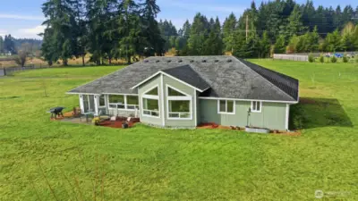 The style of this home extends to the exterior design as you see the back view.