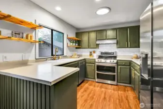 The kitchen offers plenty of room to cook, gather, and stay part of the conversation.