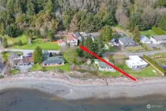 Drone view shows location in relation to the beach.  Community beach access just up the road from the house.