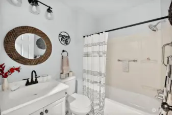 Bathroom situated between two bedrooms