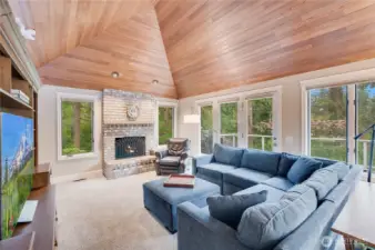 Family room off the kitchen with warm fireplace