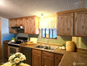 This photo is virtually staged to give you ideas of how you may like to decorate your kitchen.