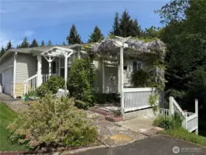 This is a very unique property with primary bedroom on main level and 2 bedrooms, another full bath, more storage and a large bonus room in the daylight basement as well as a sliding door and deck.