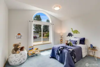 The second bedroom has charming vaulted ceilings and lots of natural light.