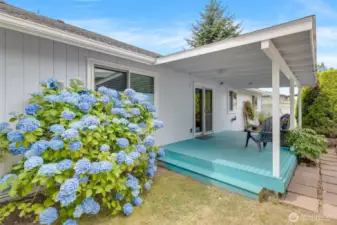 In the backyard is a darling covered patio deck.
