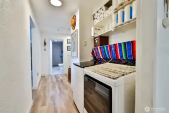 Hallway leading to bedrooms and fully remodeled bathroom