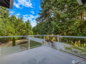 The balcony off the primary bedroom is the perfect spot to sit and enjoy the outdoors...relax, reflect, rejuvenate!