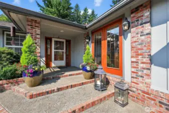 A lush, landscaped front entry courtyard provides a serene welcome to the home.”