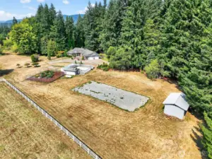 Set on 11+ acres, this home offers a fenced garden and a convenient flat gravel area for RV parking.