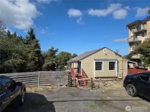 Newer siding and roof. Two separate entrances for the upstairs unit.