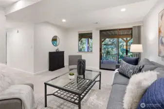 Lower level rec room is a great play space and has a sliding door that leads to a large concrete patio that's wired for a hot tub.