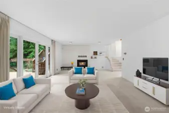 The living room has a nice propane insert to create a warm space.  (this picture virtually staged)