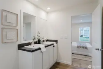 En suite bathroom to primary bedroom