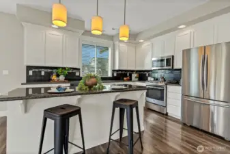 Granite counters, large island and ample cabinet space.