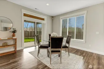 Dining area with slider to back covered patio.