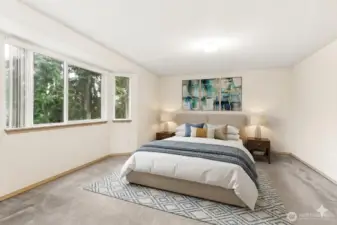 Virtually Staged Primary bedroom w full bathroom shower and soaking tub