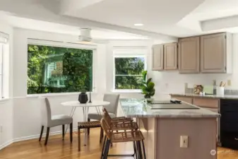 Kitchen granite island with ample space to gather.
