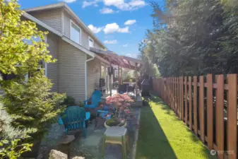 Enjoy green grass all year long with the professionally installed turf. This backyard provides the utmost privacy with the mature landscaping and trees, must see to appreciate the space