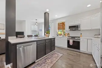 Gorgeous, spacious kitchen with large island-all recently painted and updated with beautiful penny tile full backsplash and newer appliances
