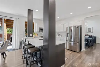 Open concept kitchen, eating nook and family room area, lots of entertaining space here, it truly is the heart of the home, large sliding glass doors welcome you to the covered outdoor area for more entertaining space