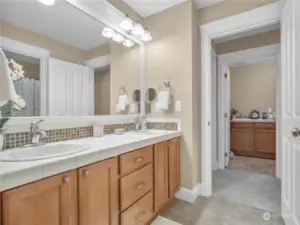 The hall bathroom is centrally located between all 3 secondary bedrooms. The utility room is across the way.