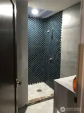 This 3/4 bath is getting it's final steps before these shimmery blue tiles, marble floors and large tile wall work is complete.  This is looking pretty gorgeous.  Behind the door is a large cedar sauna box, ready for the new owners to install the sauna mechanics, or use as a large storage.  It's quite pretty either way.