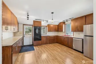 Unit A's spacious kitchen.  Plus this home doesn't have an HOA which means no rules, just pure freedom. This property lets you live life on your terms with none of the restrictions that come with an HOA. And Unit A’s brand-new deck is ready for you to kick back, enjoy the fresh air, and take full advantage of that freedom. Whether you’re entertaining or just lounging in peace, this outdoor space is all yours to enjoy however you want. It is the kind of flexibility that’s hard to come by these days.