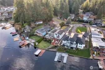 Bird's-eye view of waterfront home with deep-water moorage