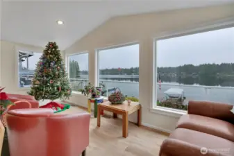 Sunroom designed for relaxation with calming water views