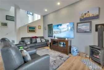 Specious family room with vaulted ceilings, natural light, and flexible living space