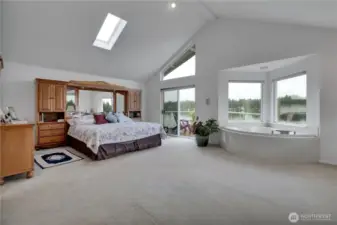 Spacious main bedroom with private waterfront deck.