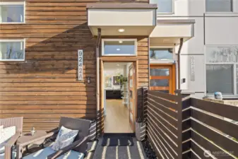 Gated entry leads to welcoming patio space.