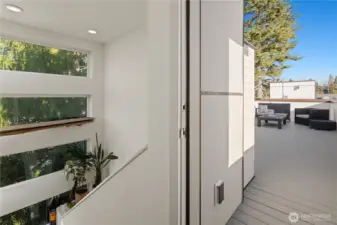 Beautiful light with extra windows leading up to the rooftop deck.