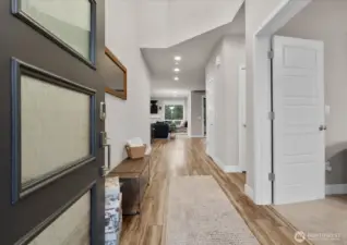 You are greeted by vaulted ceilings and gleaming wood floors as you enter this amazing home.