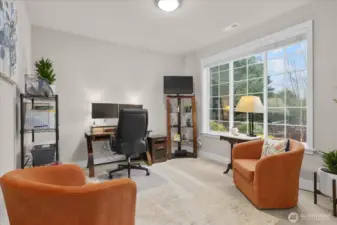 The large den is a great flex space - use as a home office, guest room or more!